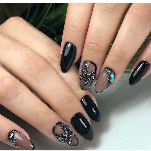 Enigmatic black manicure in elaborate design examples.