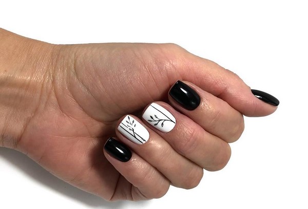 Enigmatic black manicure in elaborate design examples.